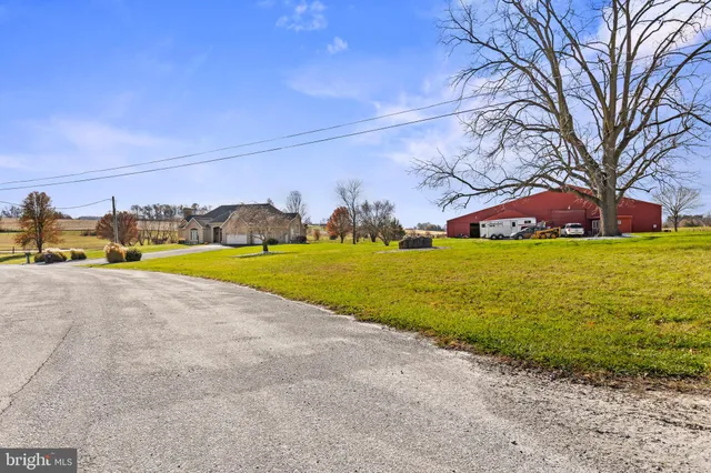 a view of a swimming pool with an outdoor space and seating area