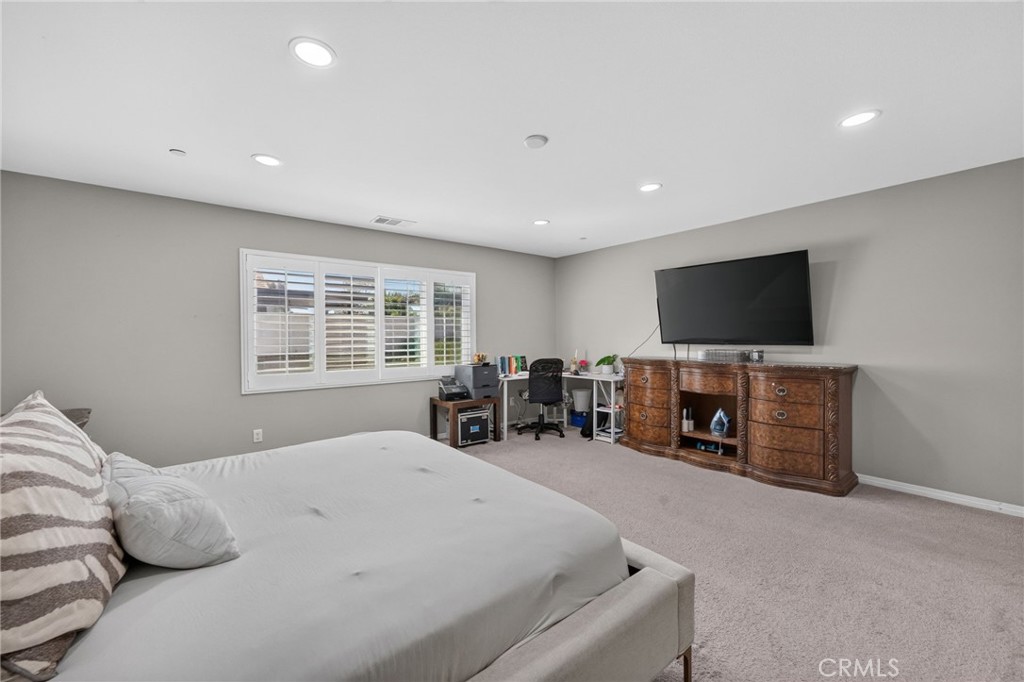 23347 Crystal Way Wildomar, CA 92595 - Photo 84 of 109 a bedroom with furniture and a flat screen tv