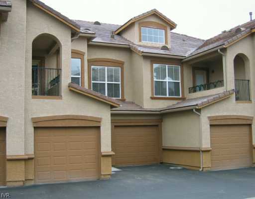 9050 Double R Boulevard, Unit 422 422 Reno, NV 89521 - Photo 1 of 6 a front view of a house with a garage