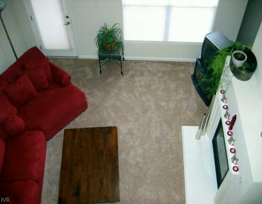 9050 Double R Boulevard, Unit 422 422 Reno, NV 89521 - Photo 6 of 6 a living room with furniture and a potted plant