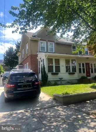 a view of a house with swimming pool and a yard