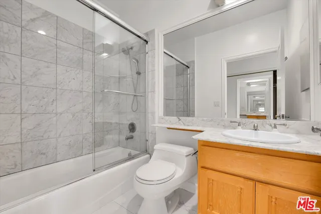 a bathroom with a sink toilet and bathtub