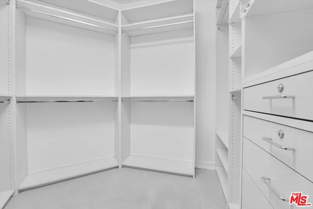 a view of an empty walk in closet
