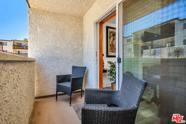 a view of house with couch and chairs