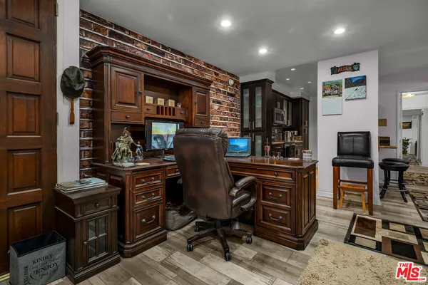 a view of a workspace with furniture