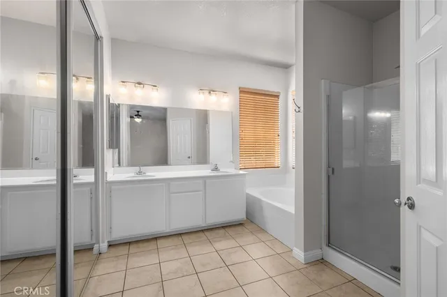 a bathroom with a tub shower and sink