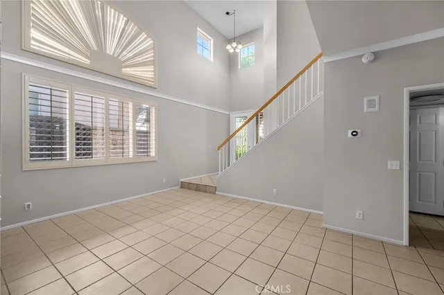 a view of an empty room with windows