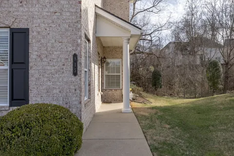 a view of a pathway of a house with backyard