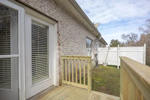 a view of balcony with wooden floor