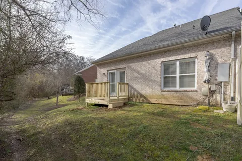 a view of a house with a back yard