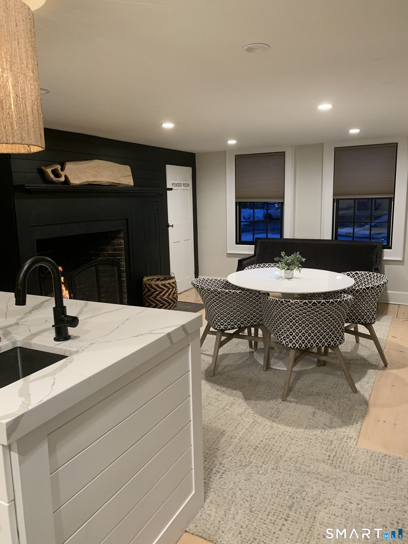 160 Main Street Wethersfield, CT 06109 - Photo 4 of 5 a kitchen with a sink and chairs