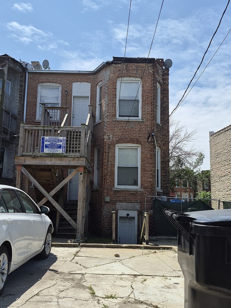 4126 West Adams Street Chicago, IL 60624 - Photo 19 of 19 a car parked in front of a house