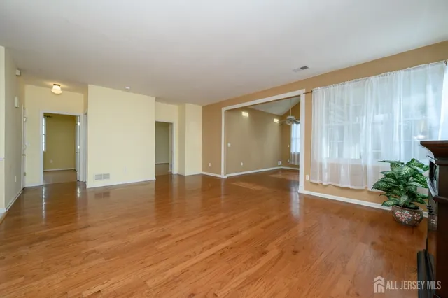 a view of a livingroom with wooden floor