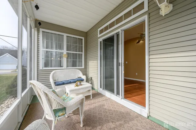 a house view with a outdoor seating