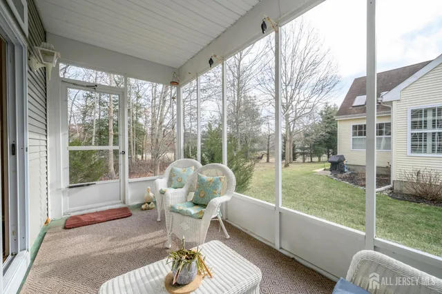 a living room with furniture and a garden
