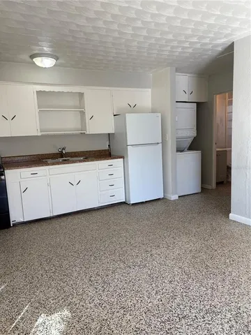 a utility room with cabinets