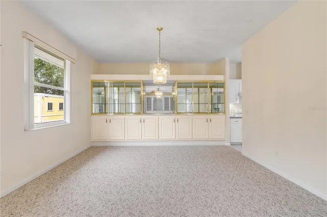 a bathroom with a sink mirror and toilet