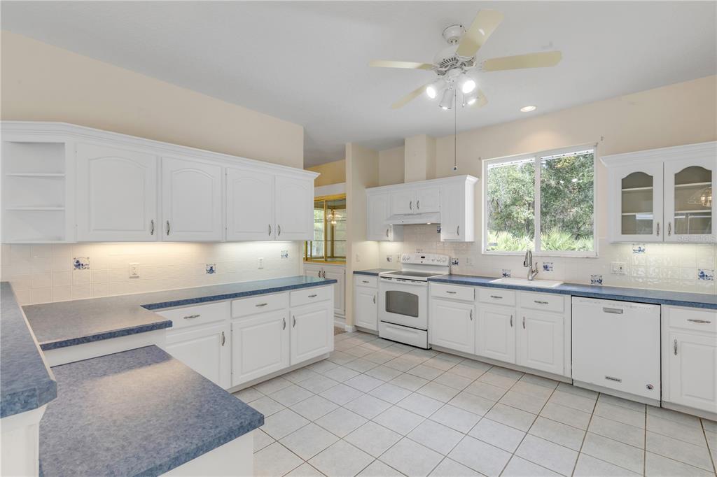 3033 Turnbull Bay Road New Smyrna Beach, FL 32168 - Photo 16 of 54 a kitchen with sink and cabinets