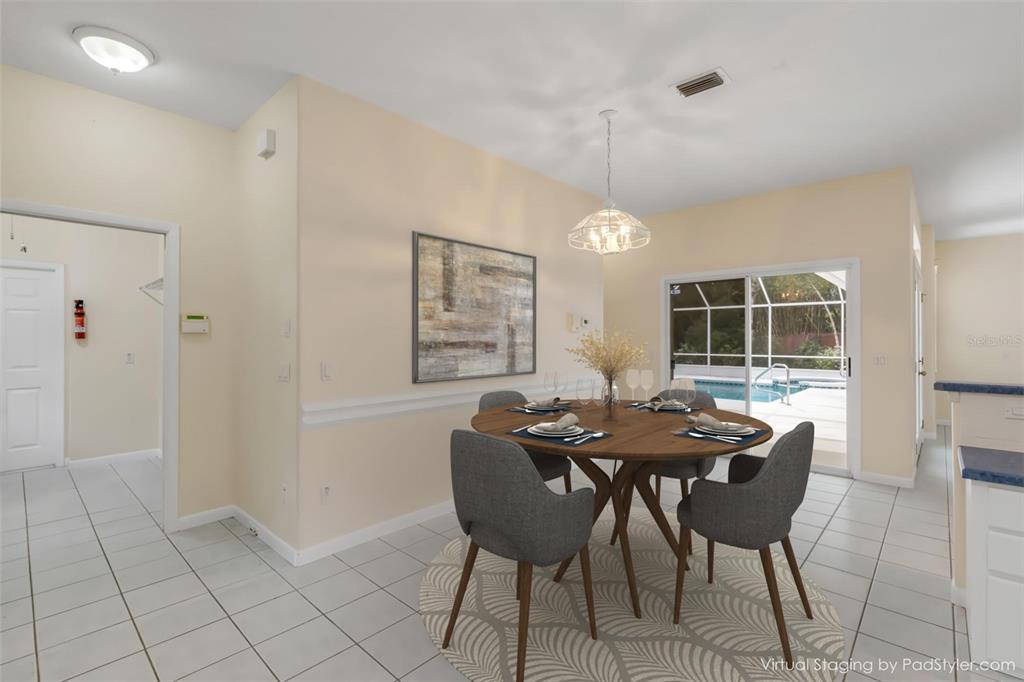 3033 Turnbull Bay Road New Smyrna Beach, FL 32168 - Photo 18 of 54 a view of a dining room with furniture window and outside view