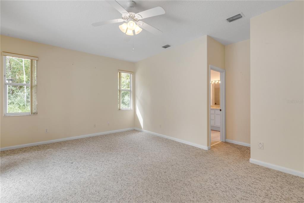 3033 Turnbull Bay Road New Smyrna Beach, FL 32168 - Photo 22 of 54 a view of an empty room with a window