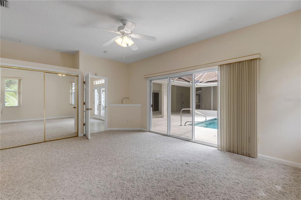 3033 Turnbull Bay Road New Smyrna Beach, FL 32168 - Photo 24 of 54 a view of a big room with chandelier front door and mountain view