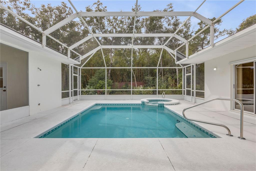 3033 Turnbull Bay Road New Smyrna Beach, FL 32168 - Photo 28 of 54 a view of a swimming pool with an outdoor space