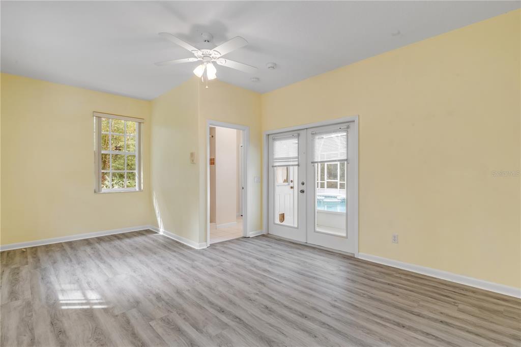 3033 Turnbull Bay Road New Smyrna Beach, FL 32168 - Photo 30 of 54 wooden floor in an empty room with a window