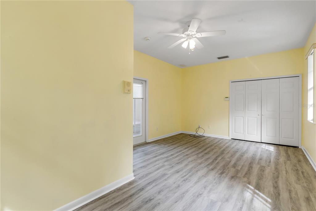 3033 Turnbull Bay Road New Smyrna Beach, FL 32168 - Photo 31 of 54 a view of an empty room with wooden floor