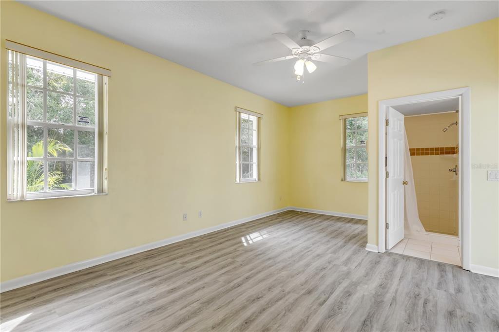 3033 Turnbull Bay Road New Smyrna Beach, FL 32168 - Photo 32 of 54 a view of an empty room with wooden floor and a window