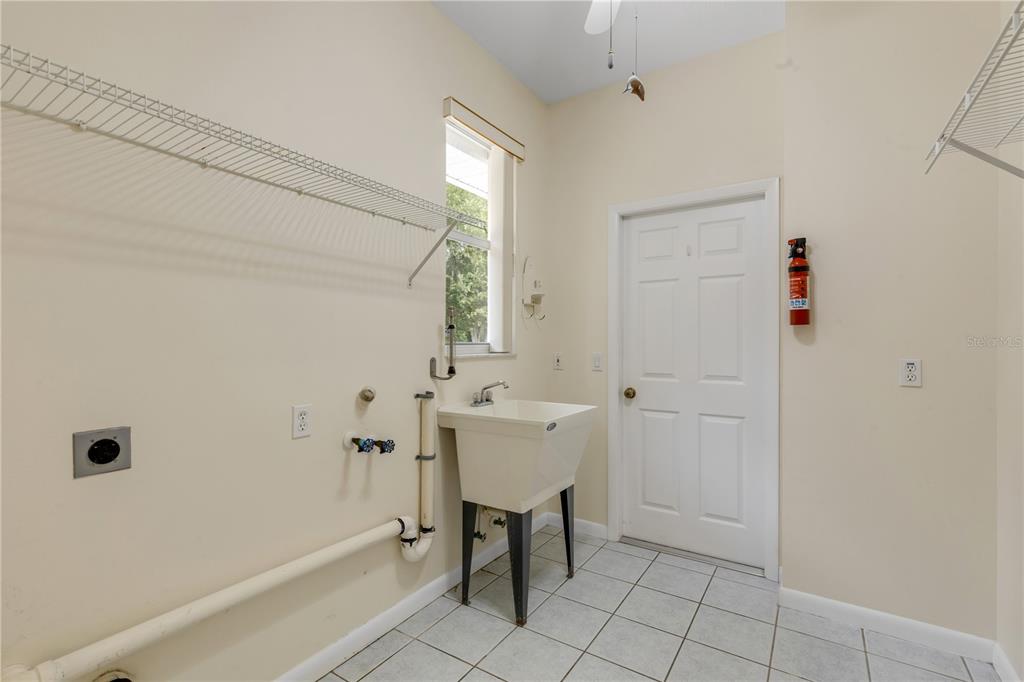 3033 Turnbull Bay Road New Smyrna Beach, FL 32168 - Photo 38 of 54 a bathroom with a sink and a mirror