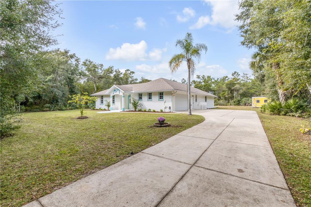 3033 Turnbull Bay Road New Smyrna Beach, FL 32168 - Photo 41 of 54 a view of house with garden