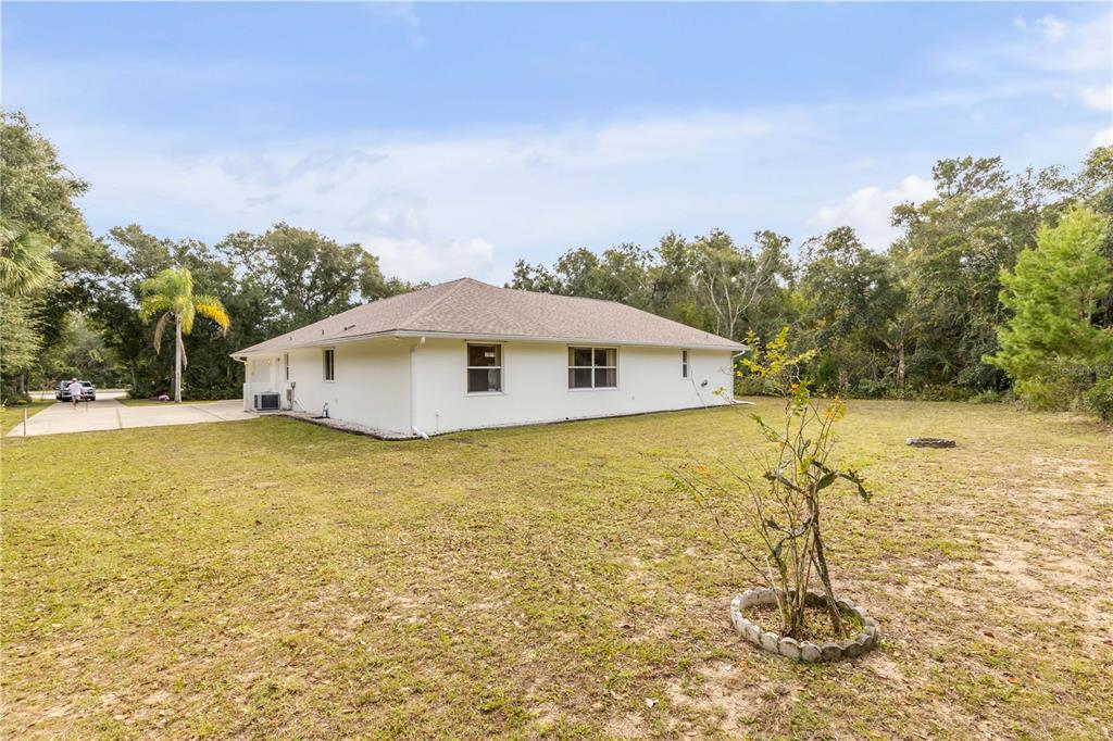 3033 Turnbull Bay Road New Smyrna Beach, FL 32168 - Photo 49 of 54 a house view with swimming pool in front of it