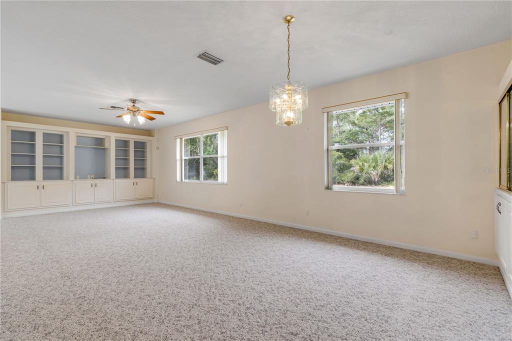 3033 Turnbull Bay Road New Smyrna Beach, FL 32168 - Photo 7 of 54 a view of an empty room with a window