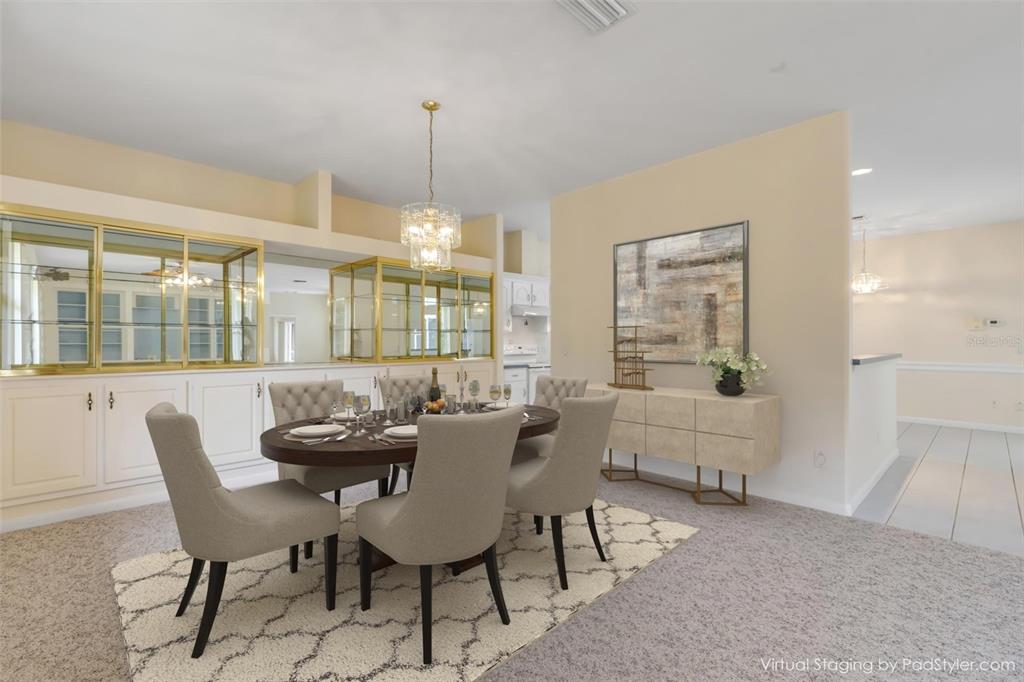 3033 Turnbull Bay Road New Smyrna Beach, FL 32168 - Photo 10 of 54 a view of a dining room with furniture window and wooden floor
