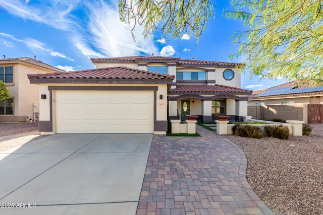a front view of a building with glass windows and door