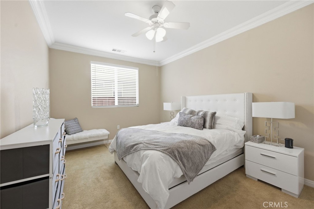 7975 Doyle Circle Hemet, CA 92545 - Photo 12 of 29 a bedroom with a bed and a window