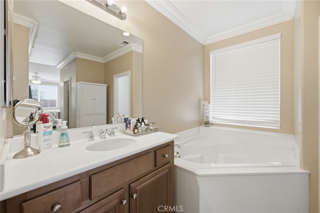 7975 Doyle Circle Hemet, CA 92545 - Photo 16 of 29 a bathroom with a sink and a mirror