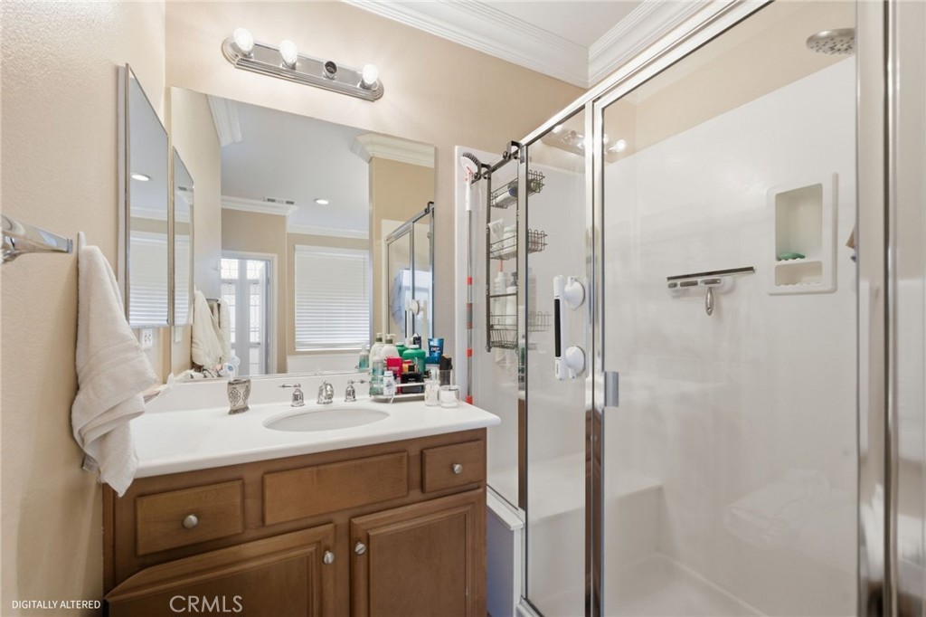 7975 Doyle Circle Hemet, CA 92545 - Photo 18 of 29 a bathroom with a sink double vanity and shower