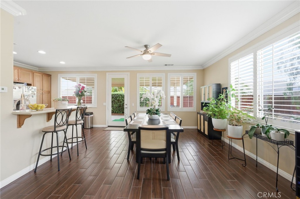 7975 Doyle Circle Hemet, CA 92545 - Photo 7 of 29 a view of a dining room with furniture window and wooden floor