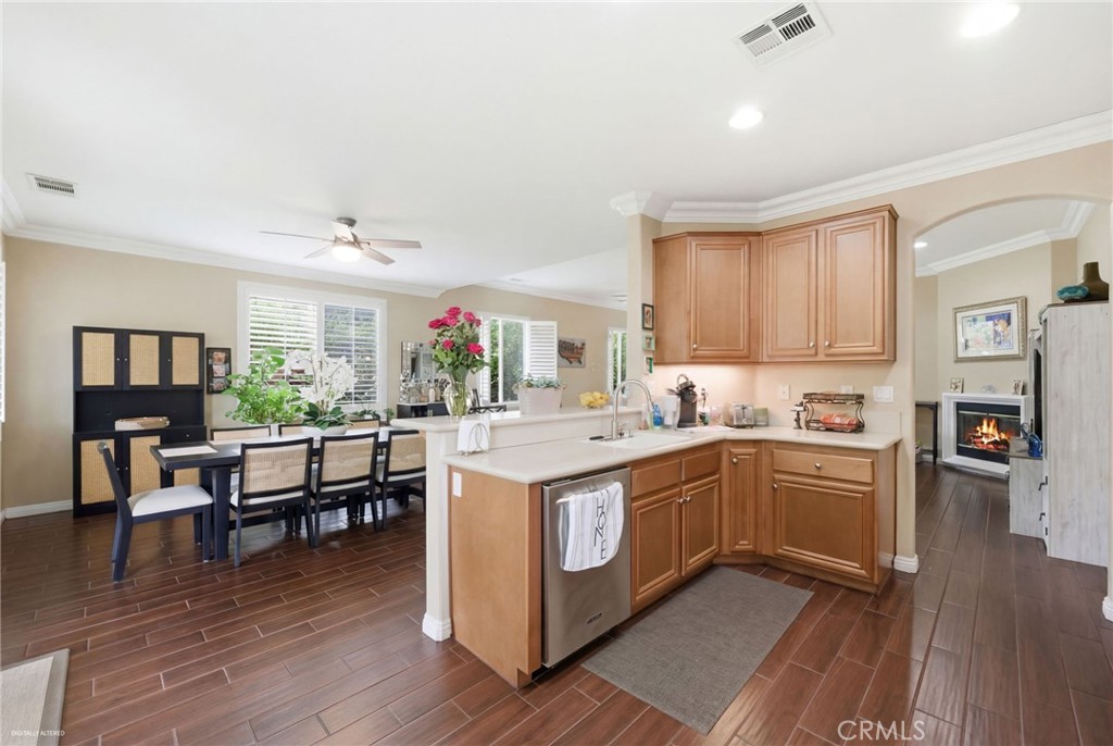7975 Doyle Circle Hemet, CA 92545 - Photo 10 of 29 a kitchen with lot of cabinets and wooden floor