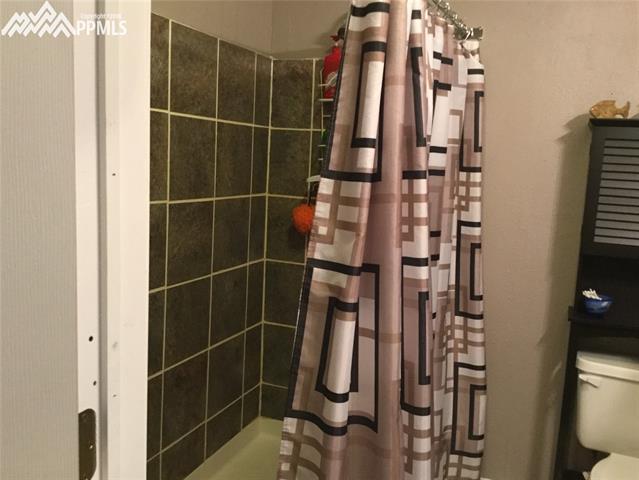 2095 Legacy Ridge View, Unit 112 Colorado Springs, CO 80910 - Photo 26 of 28 Tiled walk in shower.