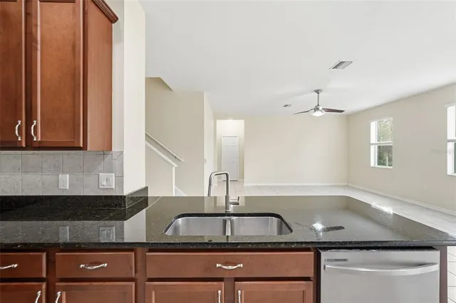 a kitchen with a sink and a window