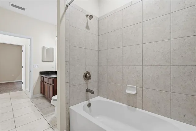 a bathroom with a sink and stainless steel appliances