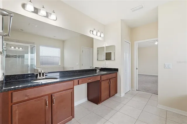 a large bathroom with a sink and a mirror