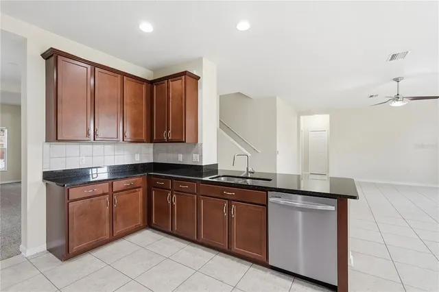 a kitchen with a sink and cabinets