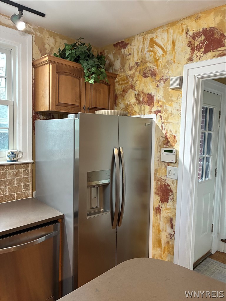 5079 Forest Road Lewiston, NY 14092 - Photo 21 of 50 STAINLESS REFRIGERATOR - EXIT DOOR TO COURT YARD