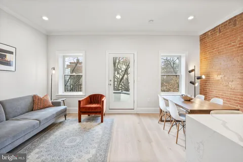a living room with furniture and windows