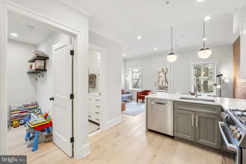 a view of a kitchen and sink