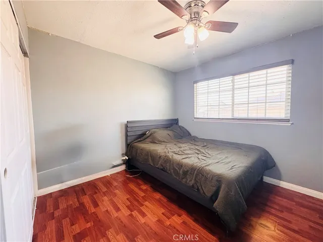 a bed room with a bed and a window