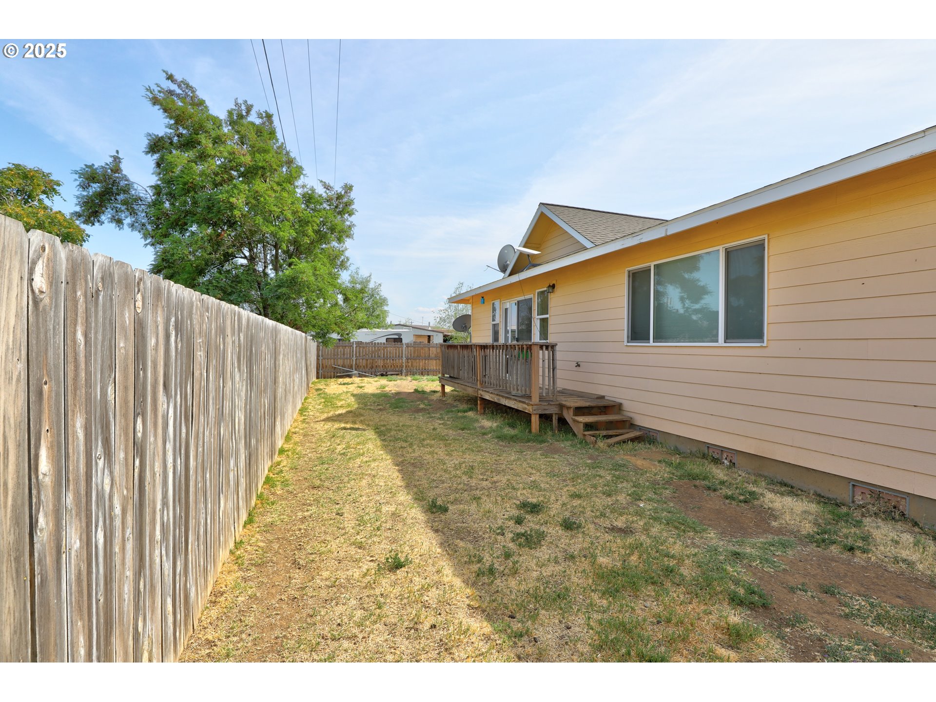 310 Columbia Avenue Roosevelt, WA 99356 - Photo 16 of 17 a view of a house with a backyard